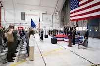 The U.S. Naval Research Laboratory Scientific Development Squadron ONE (VXS) 1 official party salutes during the national anthem at the VXS-1 change of command at the Naval Air Station Patuxent River in Patuxent River, Md. March 27, 2026. Cmdr. Luis Levine was relieved as the VXS-1 commanding officer by Cmdr. Andrew Vawter. (U.S. Navy photo by Sarah Peterson)