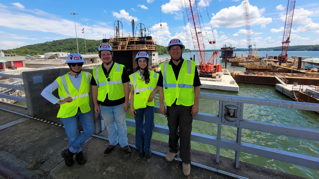 From left, Kathryn Morris, assistant district counsel for the U.S. Army Corps of Engineers Nashville District; Adam Truelove and Sophia LaGrasso, Office of Counsel externs; and Jim Roth, District Counsel, visit the Chickamauga Lock construction site in August 2025 to view progress on the new lock addition. (USACE photo)