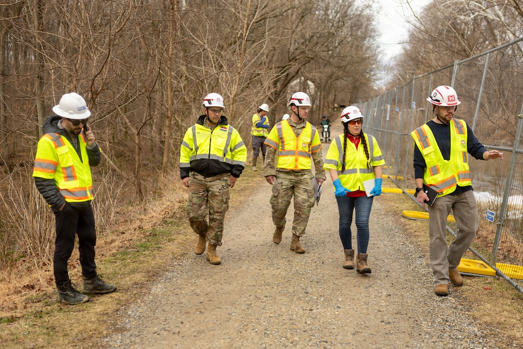 U.S. Army Corps of Engineers, Baltimore District Commander Col. Francis Pera (center) joins staff from the USACE Omaha District Rapid Response Technical Center of Expertise to discuss remediation efforts in Area 2 with interagency partners at the Potomac Interceptor collapse site in Washington, D.C., Mar. 8, 2026.