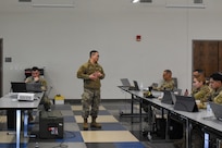 Chief Warrant Officer Pin Yao Chen, assigned to the 85th U.S. Army Reserve Support Command G4, gives remarks during a presentation to Soldiers at the 85th USARSC G4 training workshop held at Joint Base McGuire, Dix, Lakehurst, New Jersey, March 23-27, 2026.