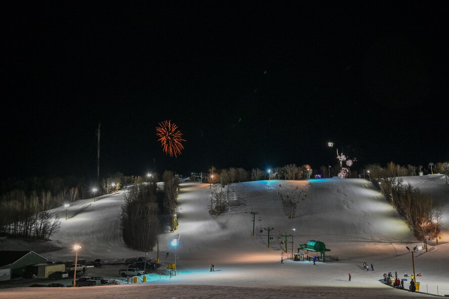 Fireworks burst above the snow-covered slopes at Bottineau Winter Park, North Dakota, March. 7, 2026. Bottineau Winter Park is an outdoor recreational park 90 min from Minot Air Force Base. (U.S. Air Force photo by Airman Joseline Chacon Monterroso)