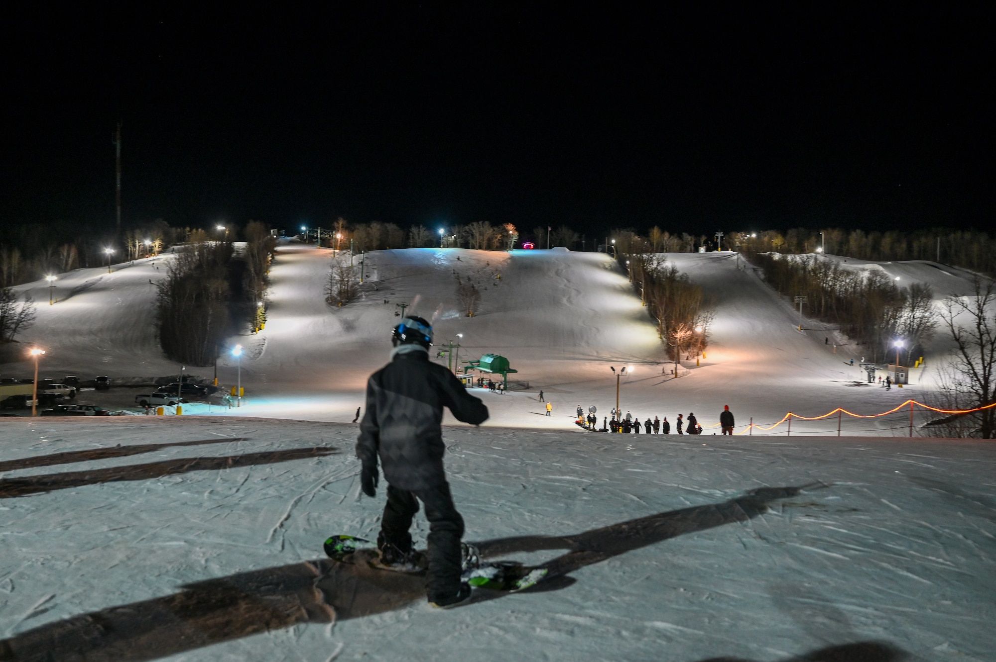 Snowboarders make their way down the slope at Bottineau Winter Park, North Dakota, March. 7, 2026. The easy to navigate park contains eight alpine trails ranging from beginner to expert. (U.S. Air Force photo by Airman Joseline Chacon Monterroso)