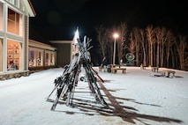 A stack of skis stand upright outside the welcome center at Bottineau Winter Park, North Dakota, March. 7, 2026. The easy to navigate park contains eight alpine trails ranging from beginner to expert. (U.S. Air Force photo by Airman Joseline Chacon Monterroso)