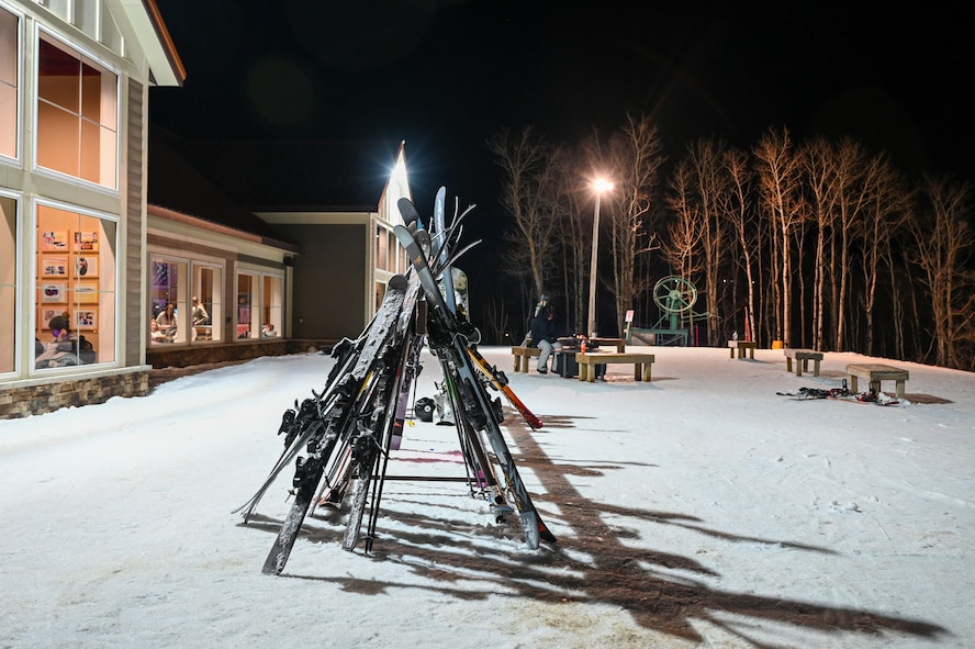 A stack of skis stand upright outside the welcome center at Bottineau Winter Park, North Dakota, March. 7, 2026. The easy to navigate park contains eight alpine trails ranging from beginner to expert. (U.S. Air Force photo by Airman Joseline Chacon Monterroso)
