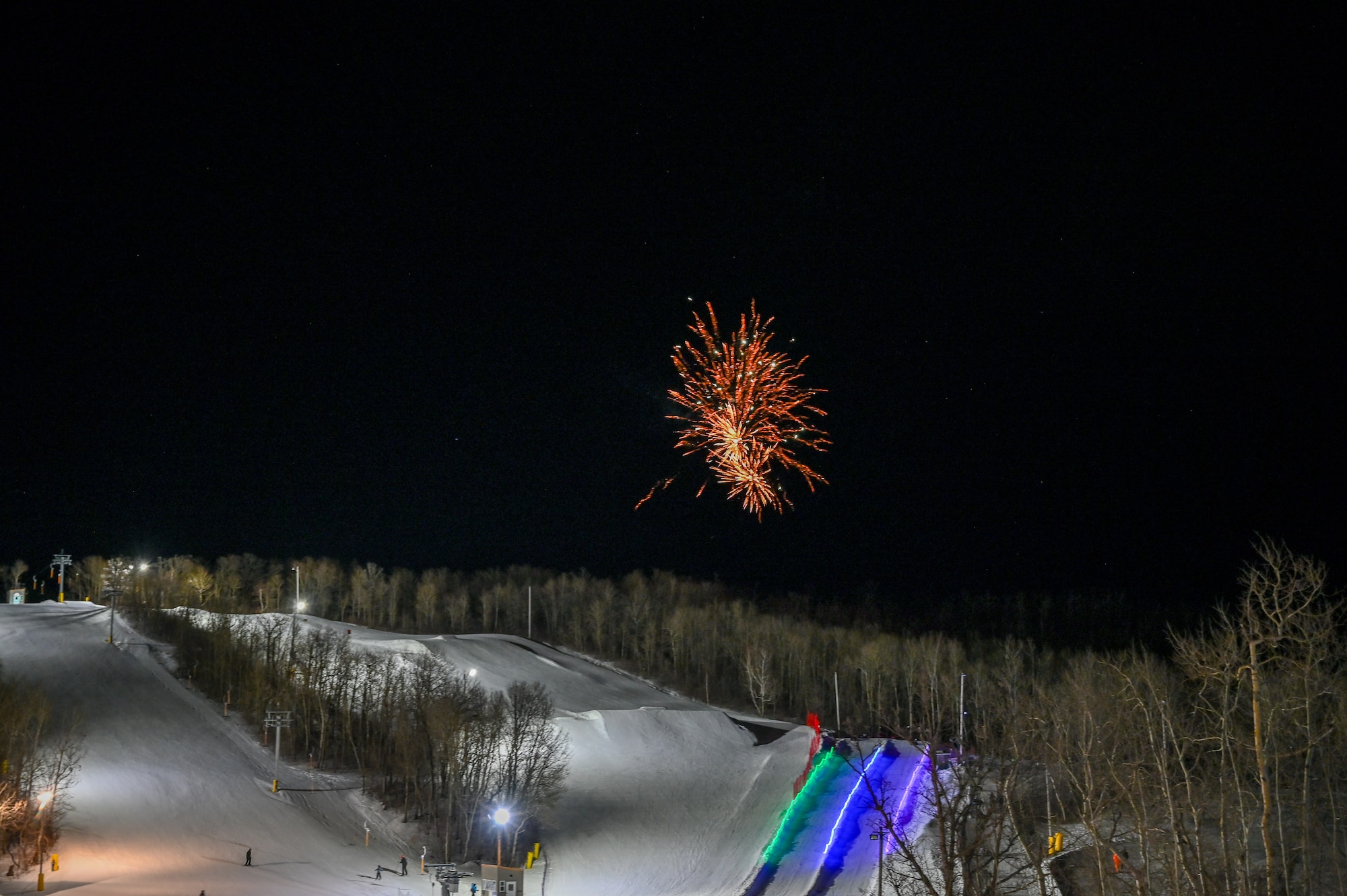 Fireworks light up the night sky at Bottineau Winter Park, North Dakota, March. 7, 2026. Bottineau Winter Park operates as a nonprofit, focused on strengthening the community through outdoor recreation. (U.S. Air Force photo by Airman Joseline Chacon Monterroso)