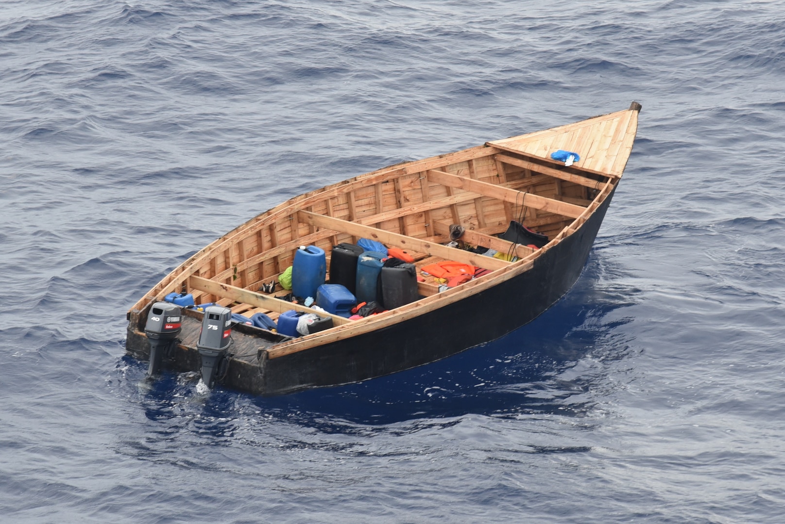Coast Guard Cutter Thetis and a Customs and Border Protection multi-role enforcement aircraft crew interdict an unlawful migration voyage vessel in Mona Passage waters off Puerto Rico, March 27, 2026.  Thetis crewmembers repatriated 60 migrants and transferred them to Dominican Republic Navy authorities in Santo Domingo, Dominican Republic, March 30, 2026.  (U.S. Coast Guard photo)