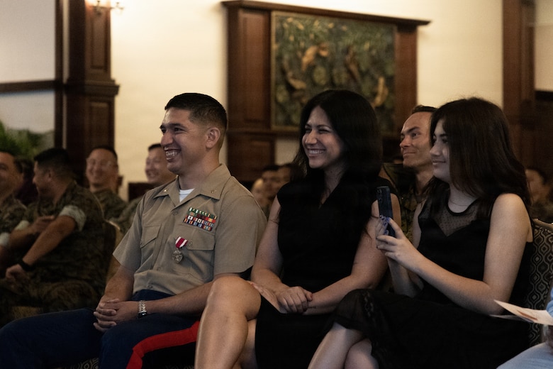 U.S. Marine Corps Maj. Gustavo Terrazas, left, G-6 deputy assistant chief of staff, Marine Wing Headquarters Squadron 1, 1st Marine Aircraft Wing sits with his family during his retirement ceremony at the Butler Officers’ Club, Okinawa, Japan, March 25, 2026. Terrazas retired after 26 years of honorable and dedicated service in the Marine Corps. (U.S. Marine Corps Photo by Cpl. Ryan Sotodavila)