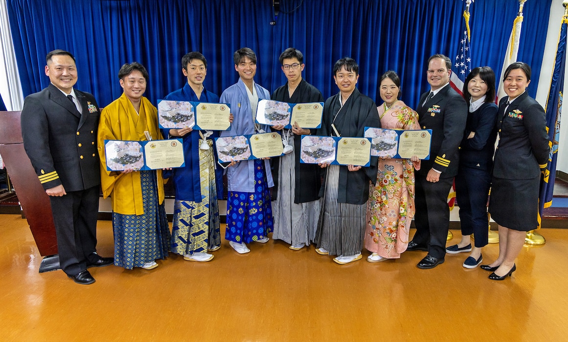 YOKOSUKA, Japan (March 20, 2026) — Graduating fellows and U.S. Naval Hospital Yokosuka leadership pose for a group photo during the Japanese National Physician Postgraduate Education Program graduation ceremony. U.S. Naval Hospital Yokosuka graduated six physicians from the yearlong program, strengthening bilateral medical readiness and patient care across the Indo-Pacific. (U.S. Navy photo by Daniel Taylor/USNMRTC Yokosuka Public Affairs)
