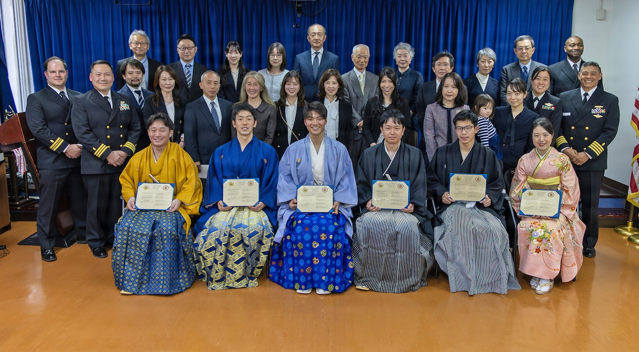 YOKOSUKA, Japan (March 20, 2026) — Graduating fellows, leadership, distinguished guests and family members pose for a group photo following the Japanese National Physician Postgraduate Education Program graduation ceremony at U.S. Naval Hospital Yokosuka. U.S. Naval Hospital Yokosuka graduated six physicians from the yearlong program, strengthening bilateral medical readiness and patient care across the Indo-Pacific. (U.S. Navy photo by Daniel Taylor/USNMRTC Yokosuka Public Affairs)
