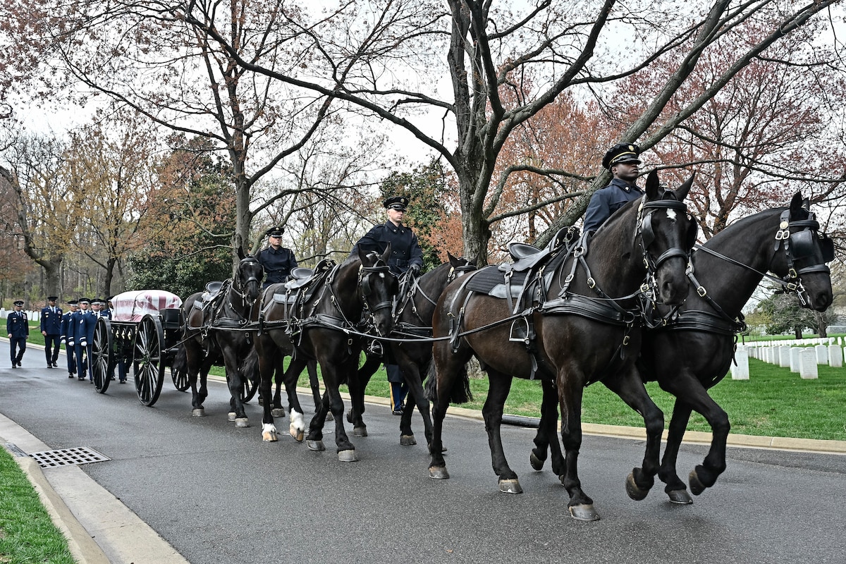 A horse-mounted honor guard draws the casket of Brig. Gen. Clarence “Bud” Anderson