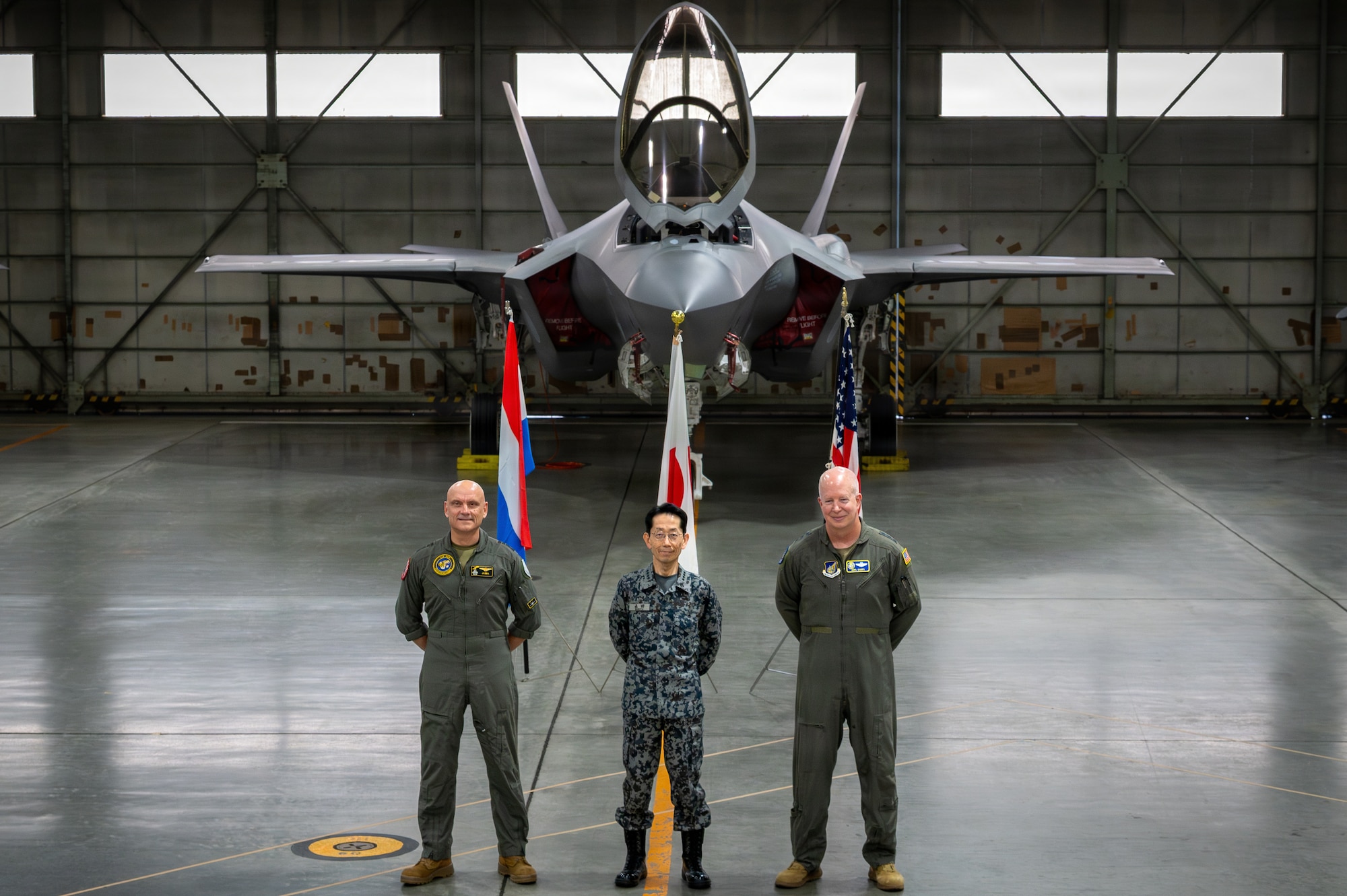 U.S. Air Force Lt. Gen. Joel Carey, right,  Fifth Air Force commander, Japan Air Self-Defense Forces Gen. Takehiro Morita, middle, Chief of Staff, and Royal Netherlands Air and Space Force Lt. Gen. André Steur, commander, pose for a photo in front of a F-35A Lightning II during Exercise Kazaguruma Guardian 26 (KG26) trilateral exercise at Misawa Air Base, Japan, March 27, 2026.