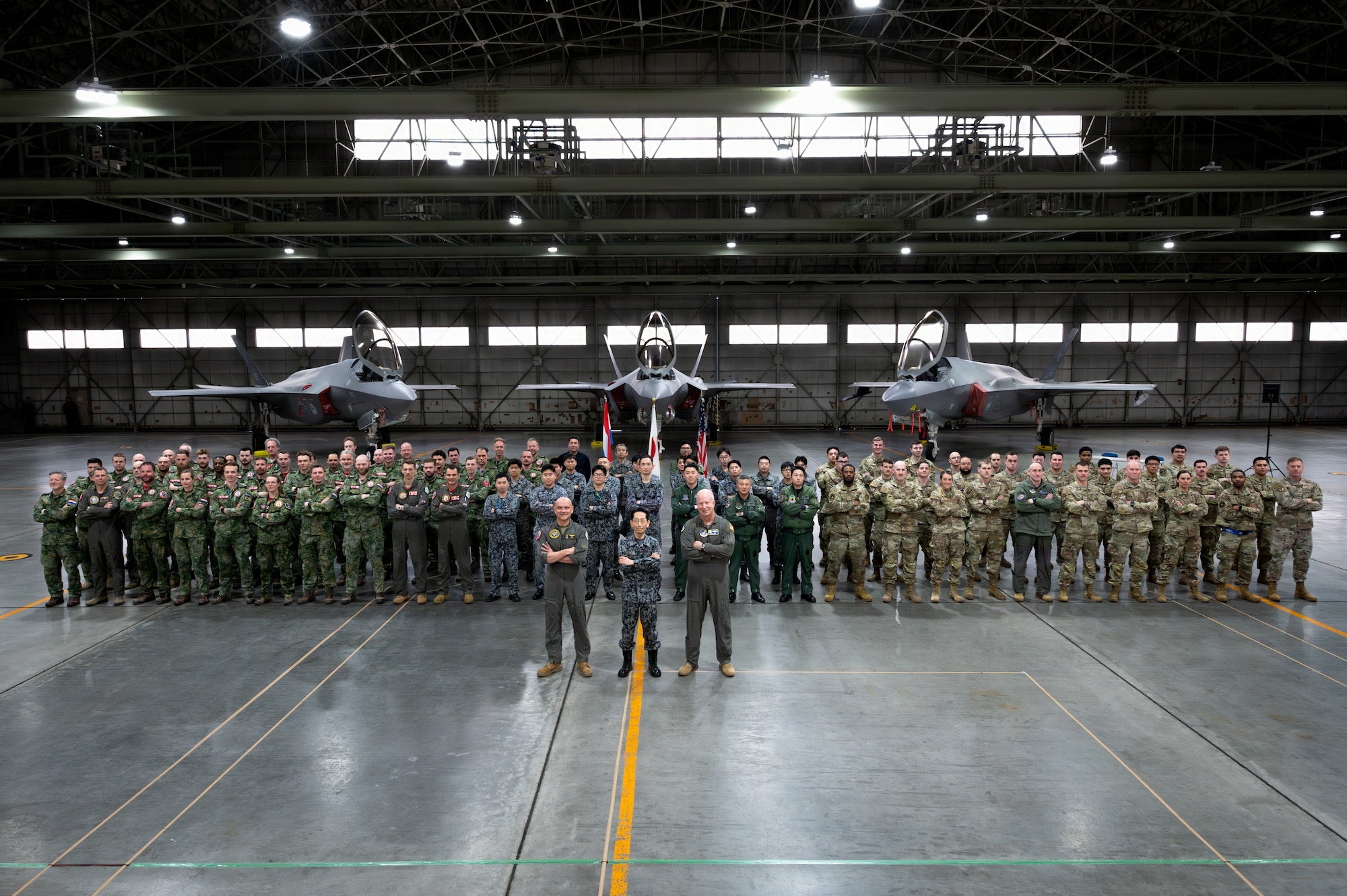 U.S. Airmen, Japan Air Self-Defense Forces and the Royal Netherlands Air and Space Force members pose for a group photo in front of an F-35A Lightning II during Exercise Kazaguruma Guardian 26 (KG26) at Misawa Air Base, Japan, March 27, 2026.