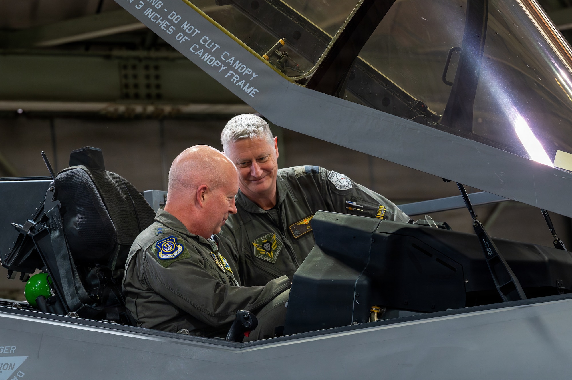 The Royal Netherlands Air and Space Force Commodore Marcel ‘Bo’van Egmond, right, combat commander, shows U.S. Air Force Lt. Gen. Joel Carey, Fifth Air Force commander, a Royal Netherland F-35A Lightning II during Exercise Kazaguruma Guardian 26 (KG26) at Misawa Air Base, Japan, March 27, 2026.