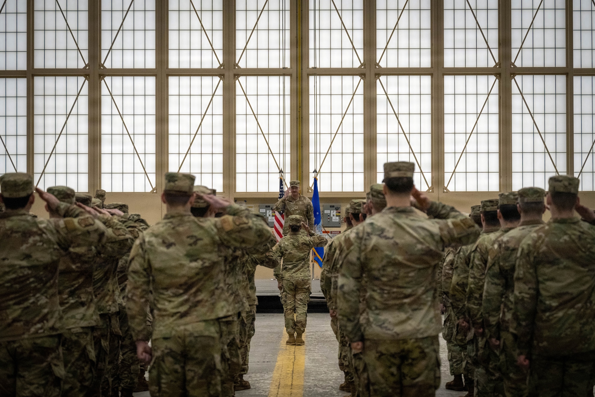 U.S. Air Force Maj. Christopher Hickman, 3d Aircraft Maintenance Squadron commander, salutes the 3d AMXS during the squadron's reactivation ceremony at Joint Base Elmendorf-Richardson, Alaska, March 6, 2026.