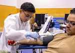 YOKOSUKA, Japan (Feb. 25, 2026) — A laboratory technician prepares a donor for blood collection during a two-day blood drive at Yokosuka’s Fleet Recreation Gym. U.S. Naval Hospital (USNH) Yokosuka, in partnership with the Armed Services Blood Bank Center (ASBBC) Okinawa, hosted a two-day blood drive at Commander, Fleet Activities Yokosuka’s Fleet Recreation Gym, Feb. 25–26, collecting 179 units of whole blood in support of operational readiness across the Indo-Pacific region. (U.S. Navy photo by Daniel Taylor/USNMRTC Yokosuka Public Affairs)