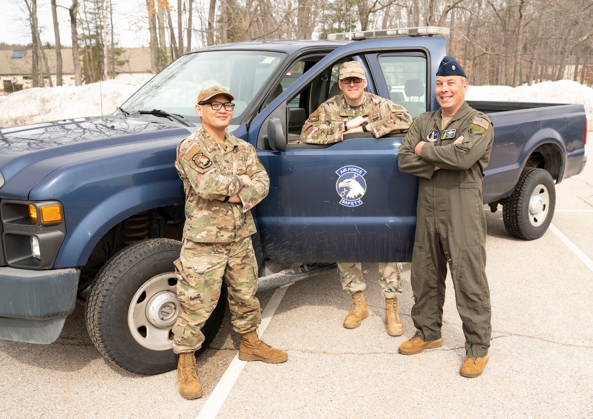 From left, Master Sgt. Tecson Chua, Master Sgt. Frank Perry and Lt. Col. Walter Hale, members of the 157th Air Refueling Wing safety team, pose for a group photo at Pease Air National Guard Base, New Hampshire, March 13, 2026.