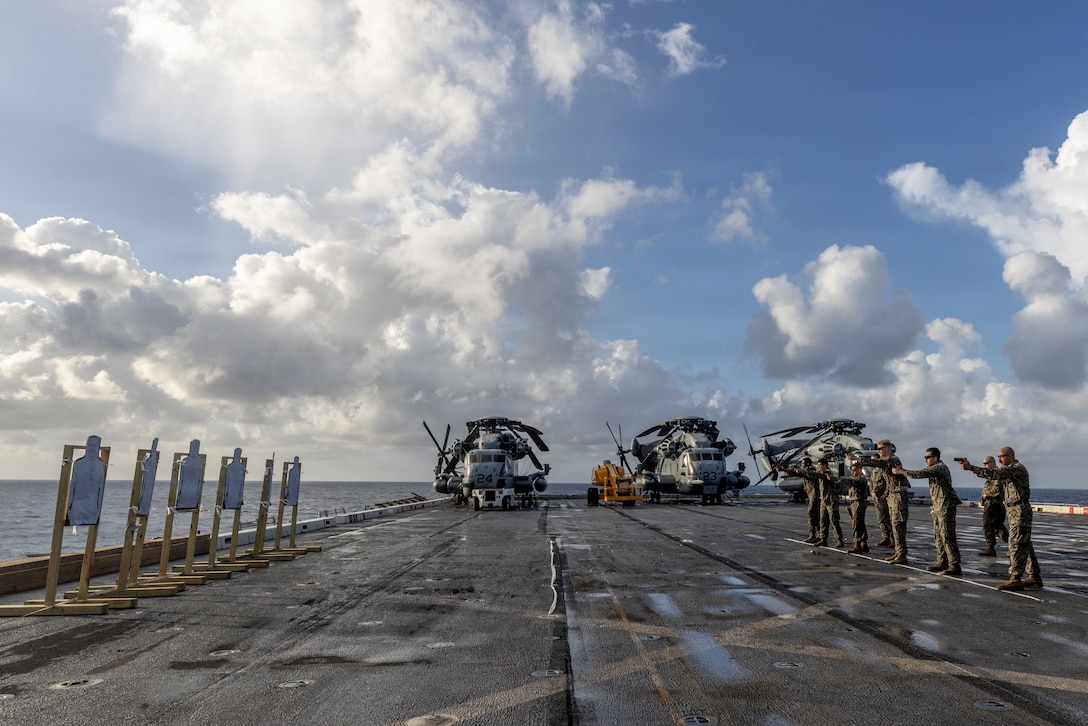 U.S. Marines with Combat Logistics Battalion 26, 22nd Marine Expeditionary Unit (Special Operations Capable), fire M18 service pistols during a pistol range aboard San Antonio-class amphibious transport dock USS San Antonio (LPD 17) while underway in the Caribbean Sea, March 10, 2026. U.S. military forces are deployed to the Caribbean in support of the U.S. Southern Command mission, Department of War-directed operations, and the president’s priorities to disrupt illicit drug trafficking and protect the homeland. (U.S. Marine Corps photo)