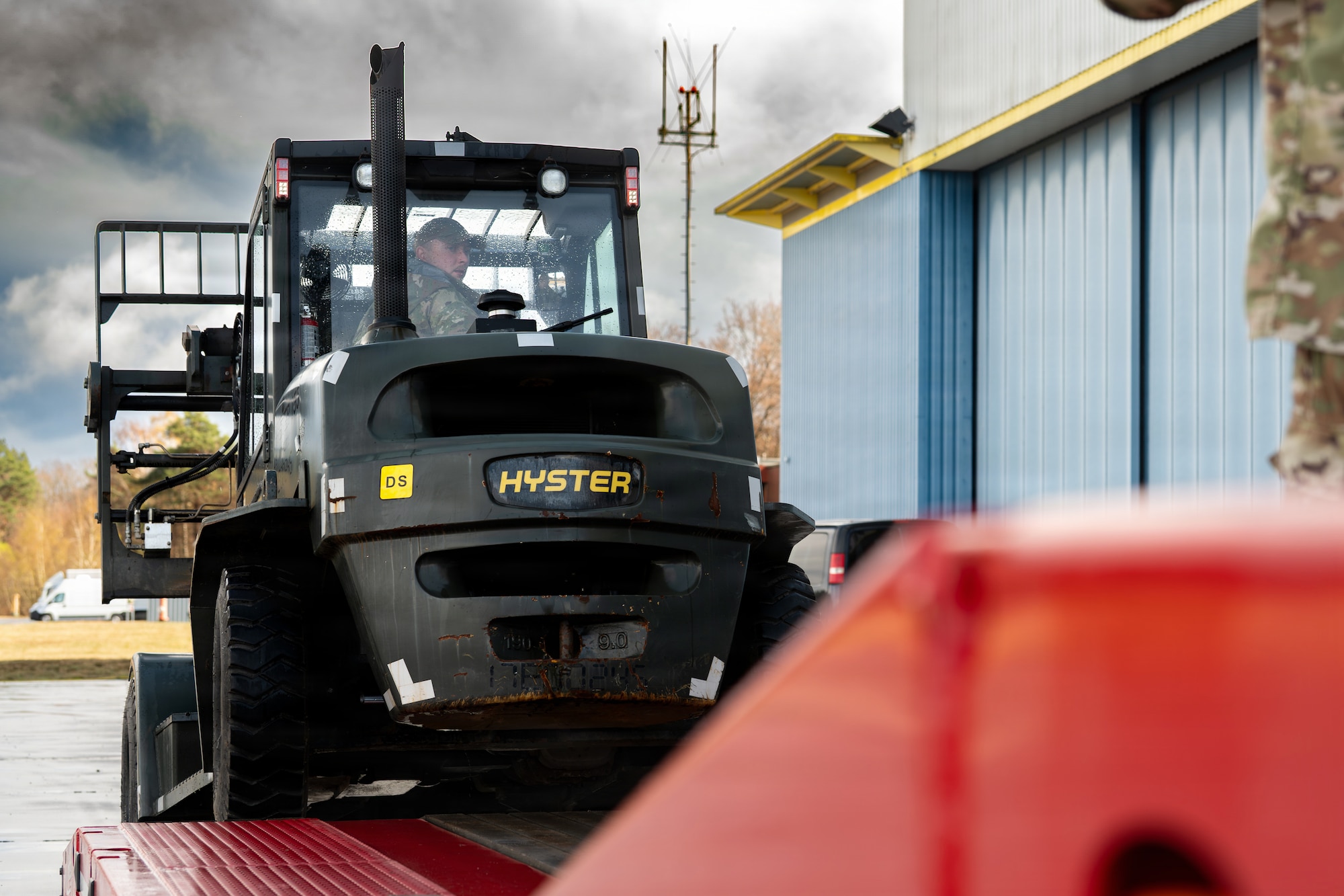 U.S. Air Force Senior Airman James Pike, 86th Vehicle Readiness Squadron ground transportation support, drives a forklift onto a trailer at Ramstein Air Base, Germany, March 25, 2026.