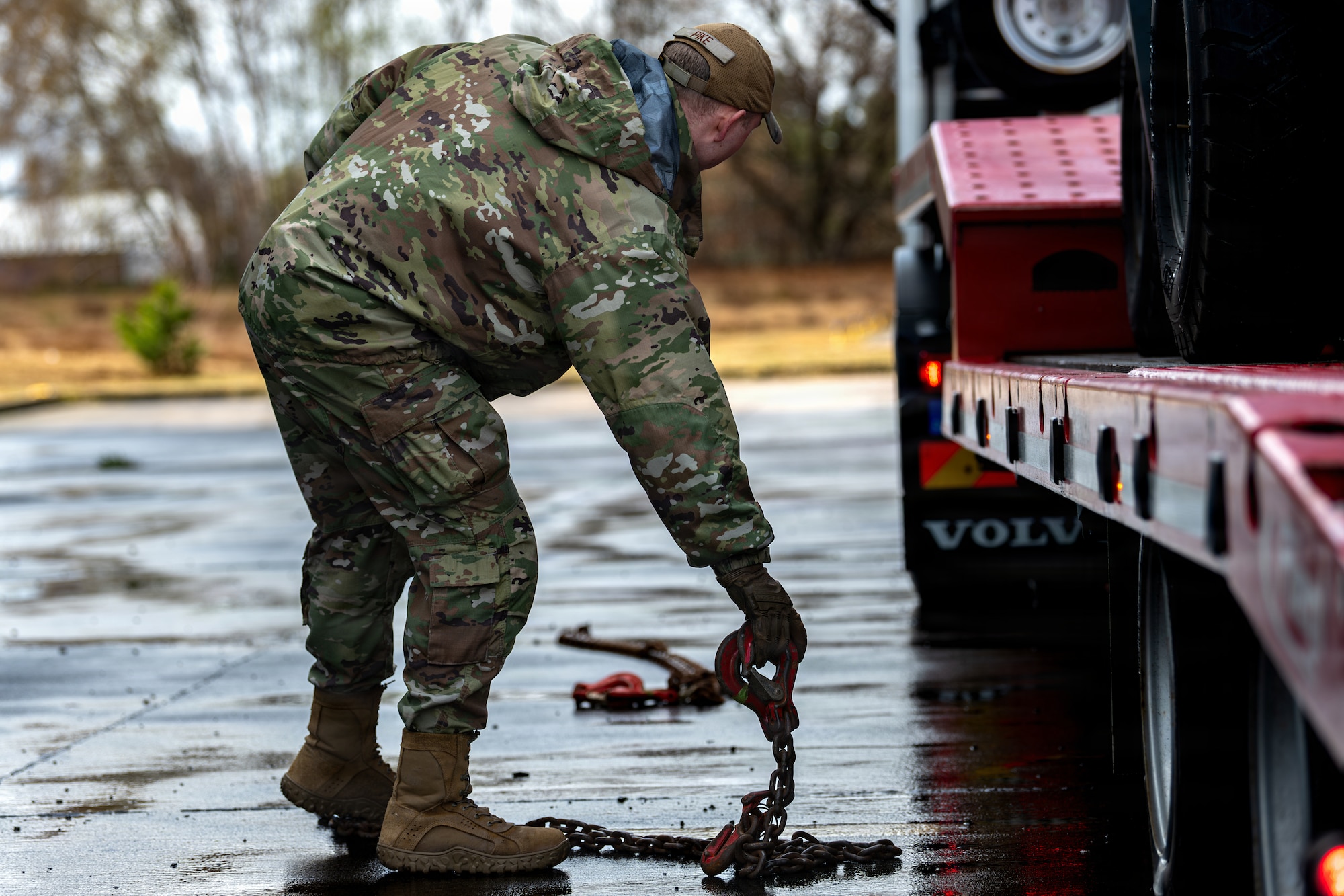 U.S. Air Force Senior Airman James Pike, 86th Vehicle Readiness Squadron ground transportation support, drops a chain at Ramstein Air Base, Germany, March 25, 2026.