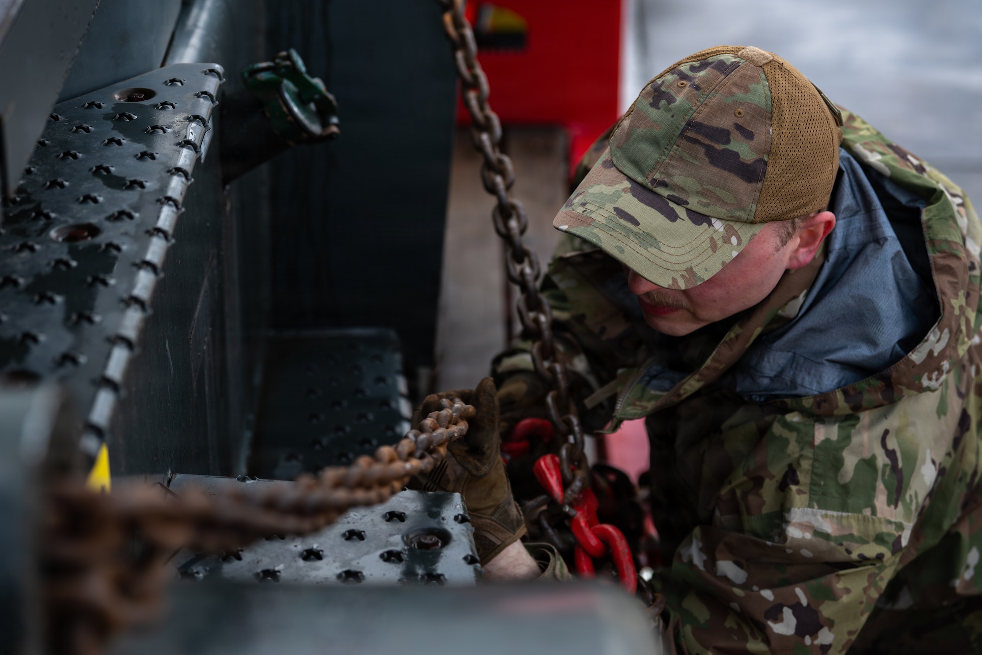 U.S. Air Force Senior Airman James Pike, 86th Vehicle Readiness Squadron ground transportation support, secures chains on a forklift at Ramstein Air Base, Germany, March 25, 2026.