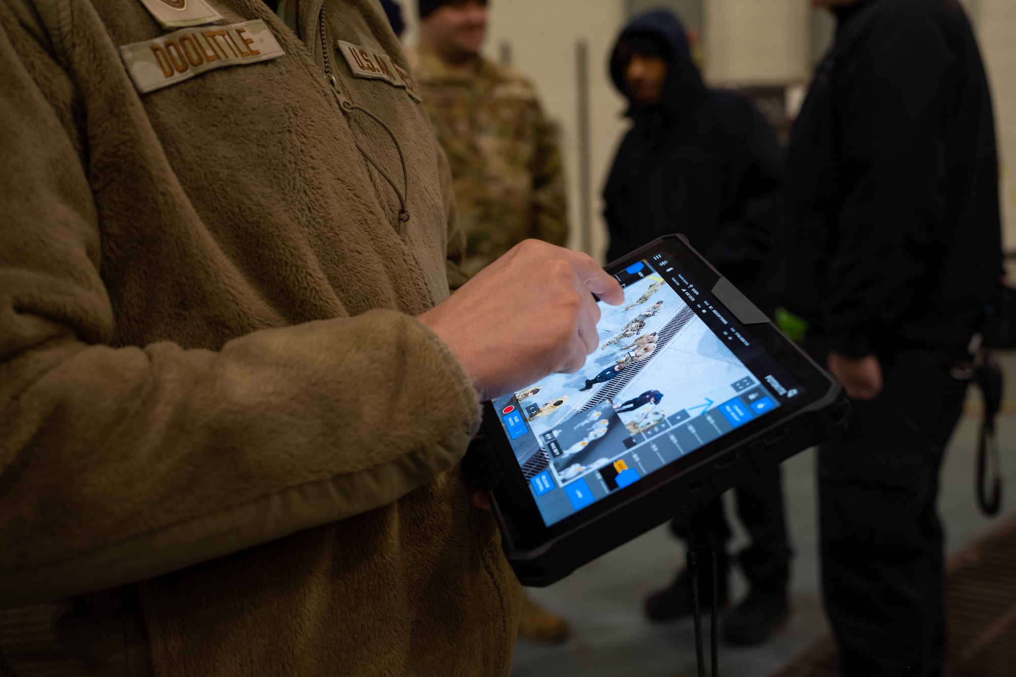 A security forces Airmen learns how to operate tethered drones.
