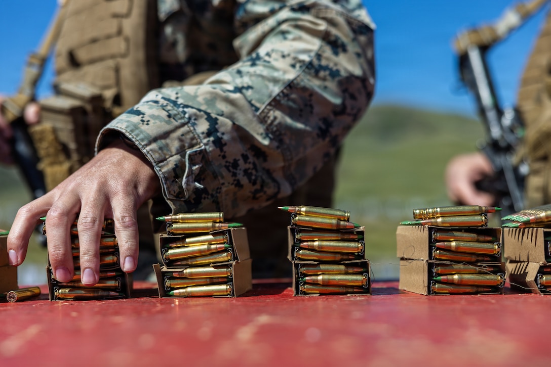 A Marine grabs ammunition during Annual Rifle Qualification