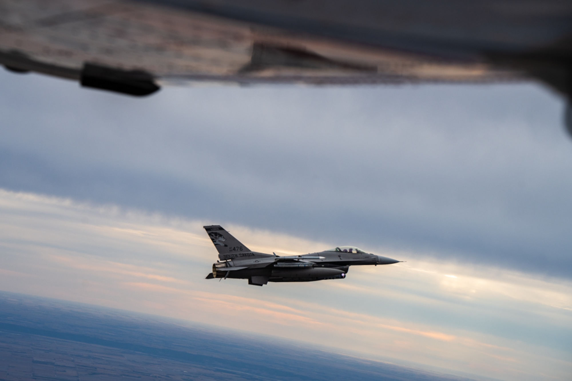 An F-16 Fighting Falcon assigned to the 114th Fighter Wing, South Dakota Air National Guard, flies alongside a Civil Air Patrol aircraft during a Felix Keynote exercise near Sioux Falls, South Dakota, Dec. 17, 2025.