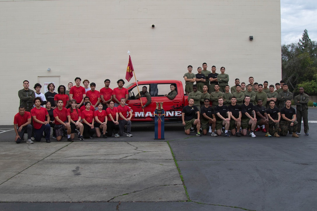 U.S. Marines and poolees with Recruiting Sub-Station Elk Grove pose for a photograph at the conclusion of an initial strength test in Elk Grove, California, Dec. 23, 2025. The IST is a preliminary physical assessment for aspiring recruits to determine their fitness level before beginning official Marine Corps Recruit Training. (U.S. Marine Corps photo by Staff Sgt. Ryan Harvey)