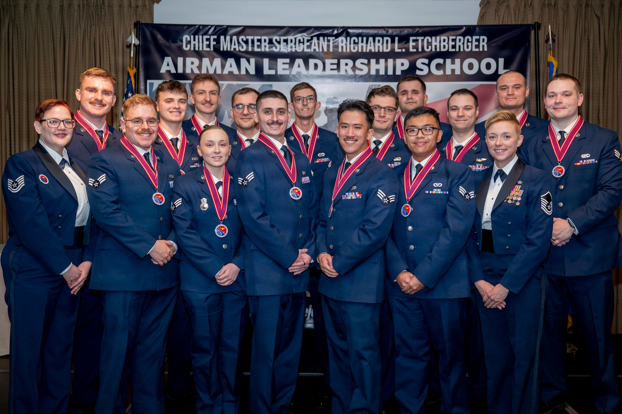 Airman Leadership School Class 26-B pose for a group photo after a graduation held at Grand Forks Air Force Base, N.D., Feb 12, 2026.