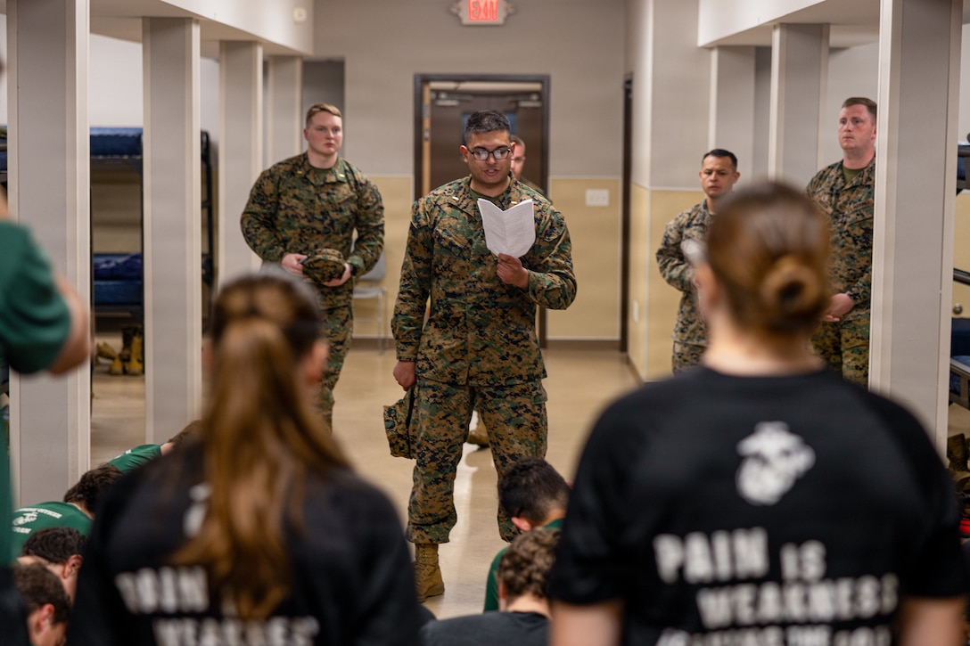 U.S Marine Corps 2nd Lt. Matthew Bush, with Recruiting Station Oklahoma City, gives orders to Mini- Officer Candidate School event attendees at Fort Smith, Arkansas, on March 27, 2026. Mini-OCS provides applicants and candidates a glimpse into Officer Candidate School by placing them through an intense training environment designed to test their endurance, resiliency, and courage. (U.S. Marine Corps photo by Lance Cpl. Kayla Goldman)