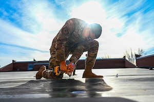 The 90 CES and other squadrons across the base quickly responded to effectively repair damage occurring on March 12, 2026, when winds reaching 92 MPH left severe damage to structures and landscaping. (U.S. Air Force photo by Senior Airman Mattison Cole)