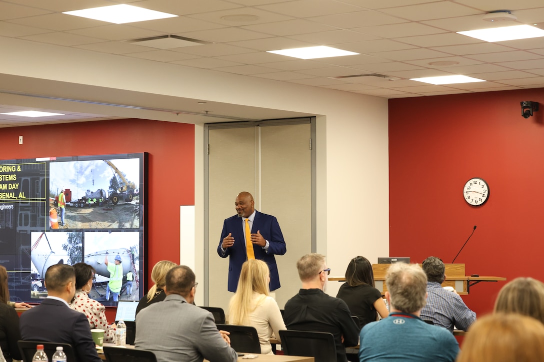 Corey Washington, Huntsville Center Utility Monitoring and Control Systems program manager, speaks with UMCS Industry Day attendees about the current state of the program and outlines priorities moving forward.