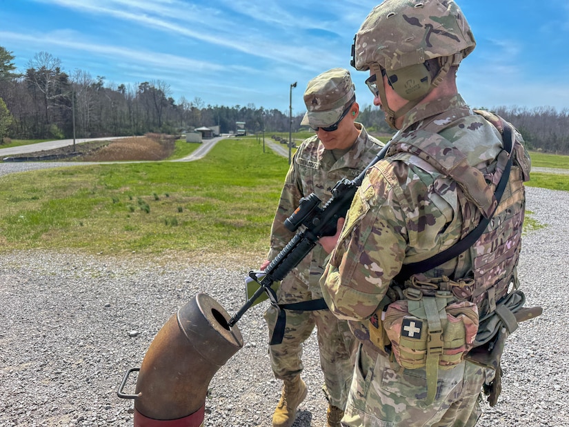 U.S. Army Sgt. Francisco Devazquez, range safety officer, observes a Soldier from the 103rd Brigade Support Battalion clearing his weapon before exiting the M4 qualification range at Wendell H. Ford Regional Training Center in Greenville, March 21, 2026.