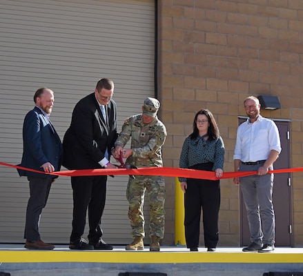 Albuquerque District Commander Lt. Col. Matthew Miller, center, joins Air Force leaders in cutting the ribbon and officially opening the Re-Entry Vehicle Integration Laboratory at Kirtland Air Force Base, N.M., March 24, 2026.
