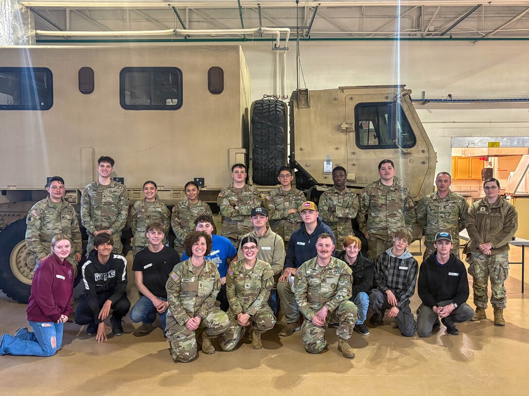 Students and Kentucky National Guard Soldiers gather for a group photo following a job shadow event in Bardstown, Kentucky, March 24.