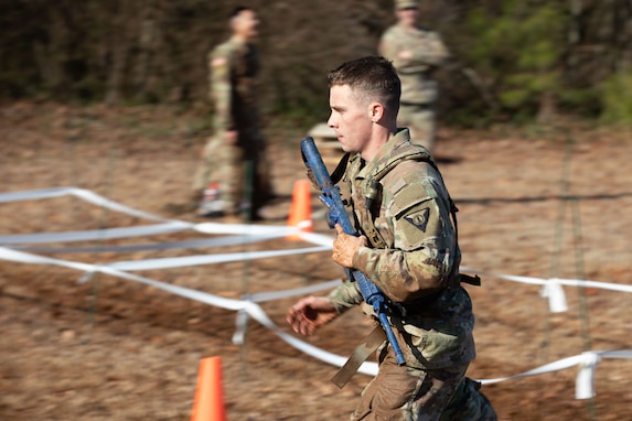 U.S. Army Pfc. Clint Reier, a horizontal construction engineer representing the Fort Stewart-based Land Dominance Center, 78th Troop Command, Georgia Army National Guard, participates in the medical and communications lane portion of the 78th Troop Command Best Warrior Competition at Clay National Guard Center, Marietta, Georgia, Feb. 1, 2025. The competition demonstrates the readiness and lethality of 78th Troop Command Soldiers by testing the competitors with physical fitness assessments, written exams, and other warrior tasks and battle drills. (U.S. Army National Guard photo by Sgt. Cameron Boyd)