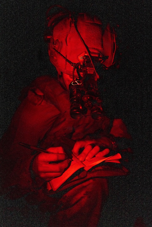 A U.S. Marine with 1st Battalion, 1st Marine Regiment, 1st Marine Division, writes down a simulated casualty’s information during the annual 1st MARDIV squad competition at Marine Corps Base Camp Pendleton, California, March 19, 2026.