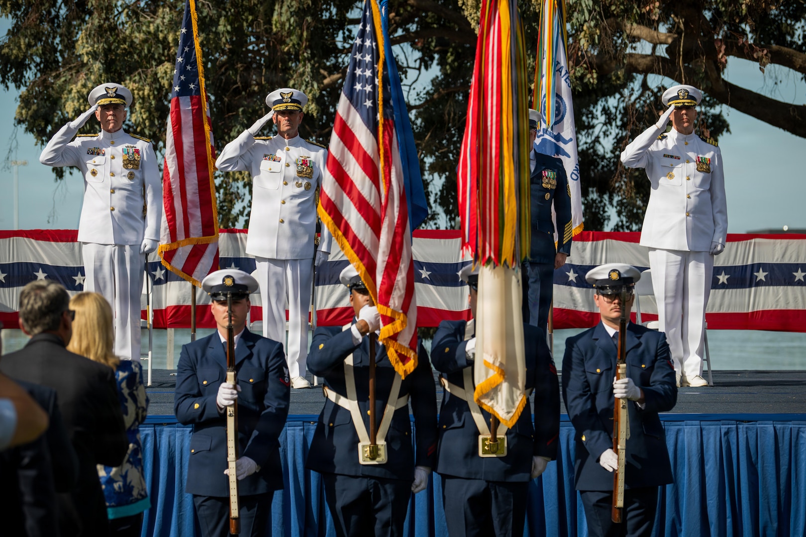 Members of the Base Alameda color guard present colors during the Coast Guard Pacific Area assumption of command ceremony, March 26, 2026, at Coast Guard Island, Alameda, California. The ceremony formally confirmed Vice Adm. Joe Buzzella as the commander of Coast Guard Pacific Area and Defense Force West. (U.S. Coast Guard photo by Petty Officer 3rd Class Kenneth Wiese)