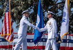 Adm. Kevin Lunday, commandant of the U.S. Coast Guard, shakes hands with Vice Adm. Joe Buzzella during an assumption of command ceremony, March 26, 2026, at Coast Guard Island, Alameda, California. The ceremony formally marked Vice Adm. Joe Buzzella as the commander of Coast Guard Pacific Area and Defense Force West. (U.S. Coast Guard photo by Petty Officer 3rd Class Charlie Valor)