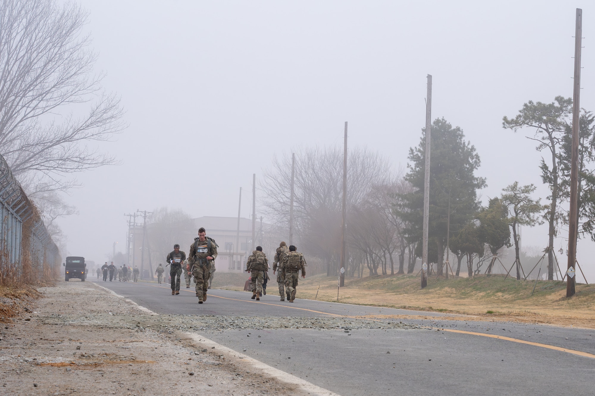 Service members participate in a 30km ruck.