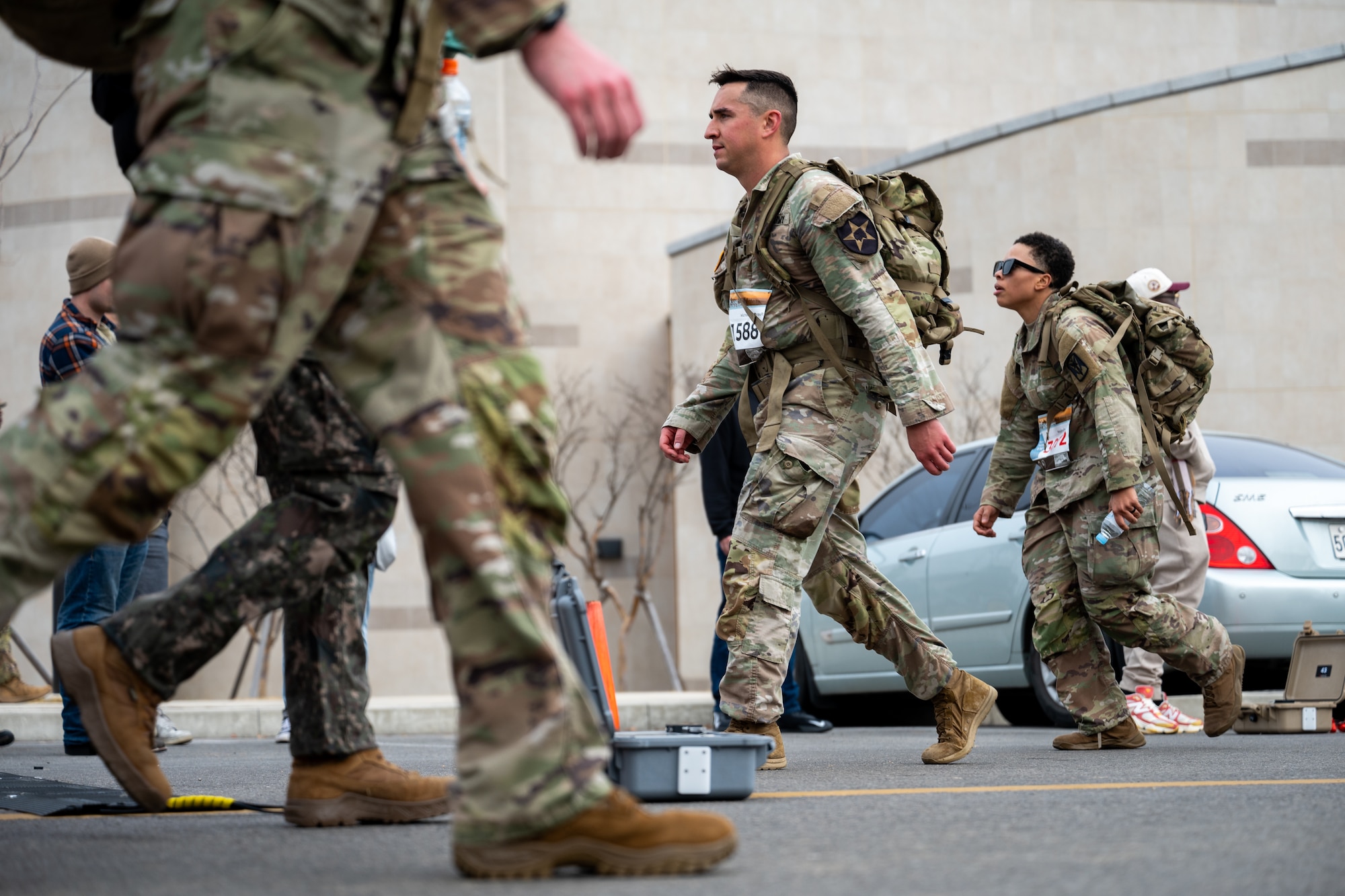 Ruckers walk past each other at a turnaround point during a 30km ruck.