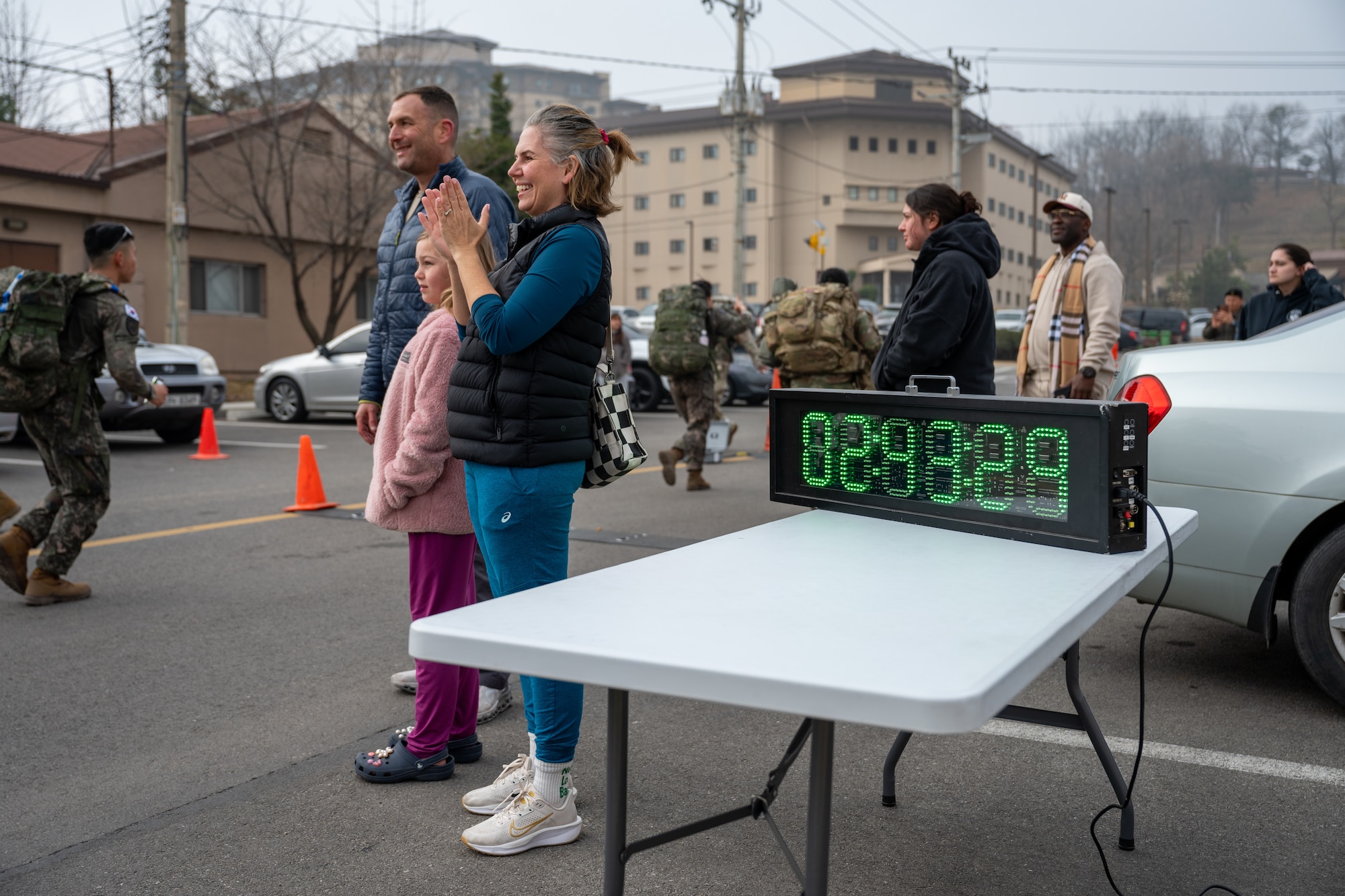 Onlookers cheer near a turnaround point for participants challenging a 30km ruck.