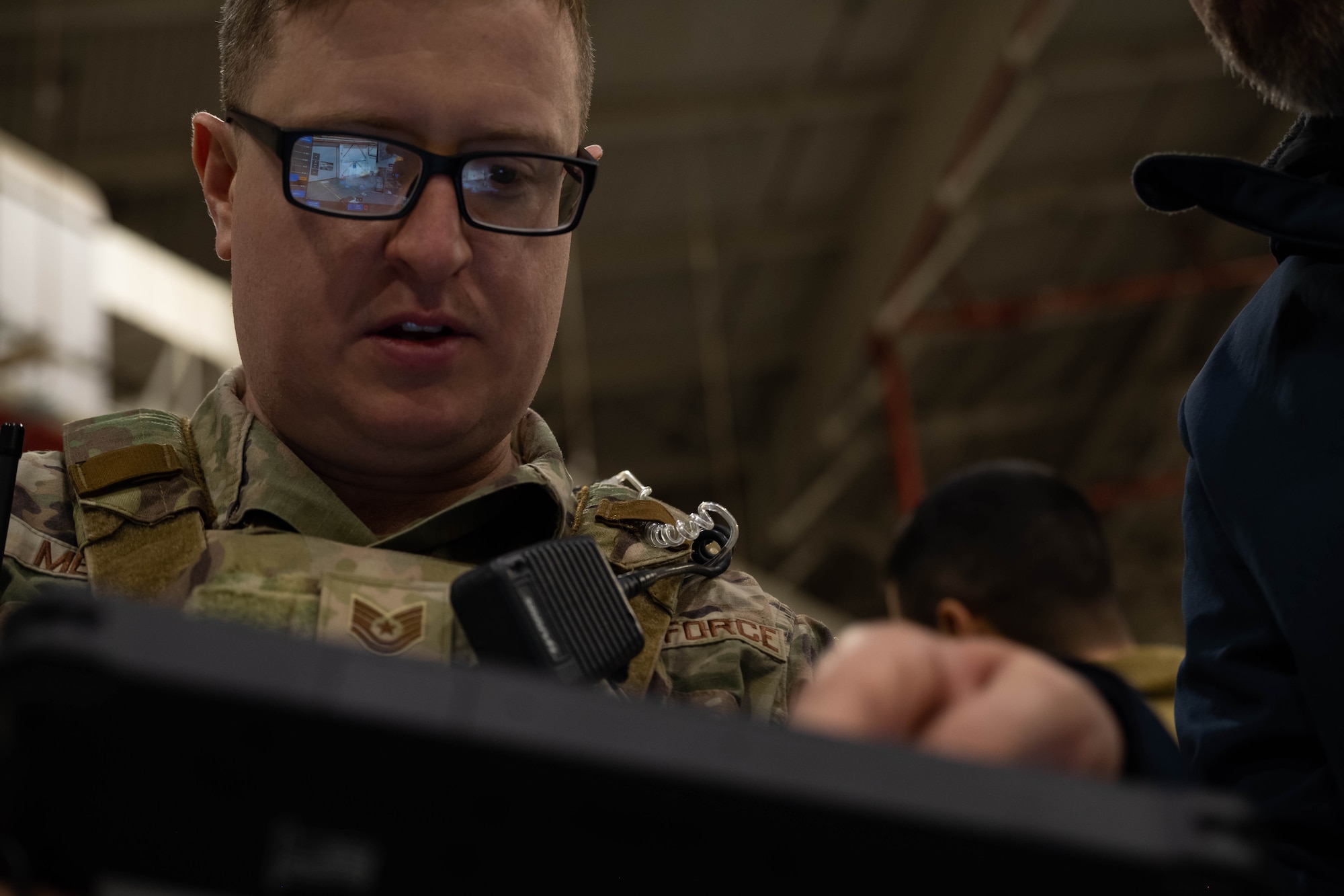 A security forces Airmen learns how to operate tethered drones.