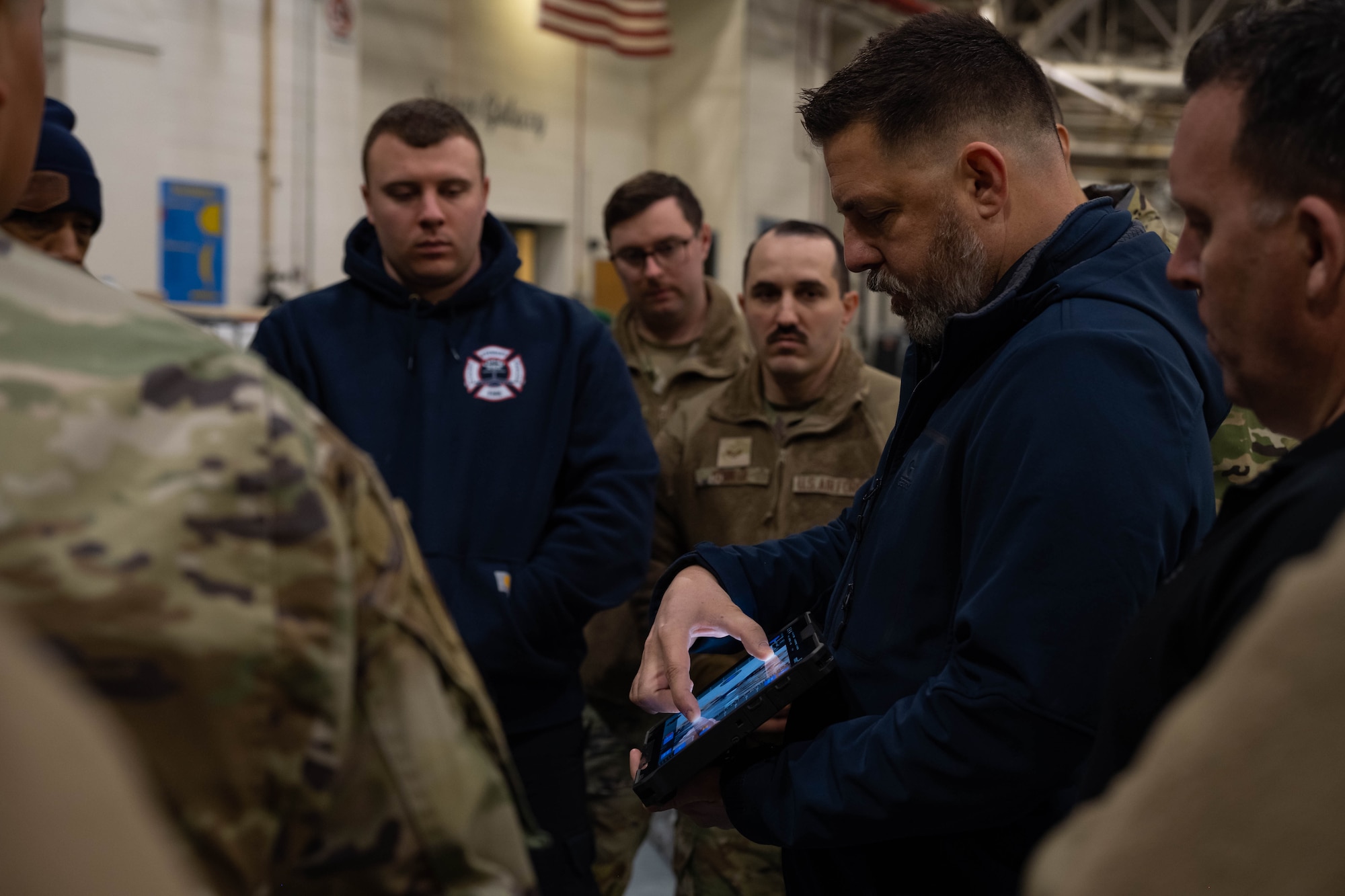A security forces Airmen learns how to operate tethered drones.