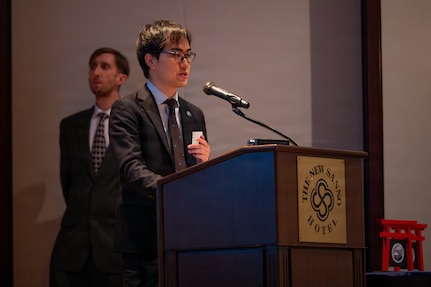Yuhei Iwata, a Japan Customs official, speaks at the U.S. Forces Japan Law Enforcement Symposium April 22, 2026, at the New Sanno Hotel in Tokyo, Japan.