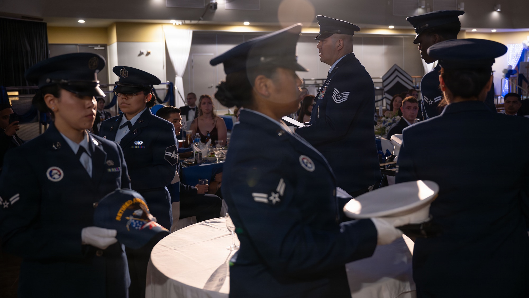 Members of the 51st Fighter Wing Honor Guard set  the Missing Man Prisoner of War/Missing in Action table during the chief master sergeant recognition ceremony at Osan Air Base, Republic of Korea, April 24, 2026. The Missing Man table is a solemn tradition dedicated to the fallen, missing, or imprisoned U.S. military service members. (U.S. Air Force photo by Senior Airman Rome Bowermaster)