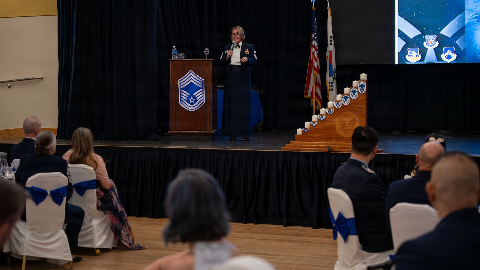 U.S. Air Force Chief Master Sgt. Katie McCool, Pacific Air Forces command chief, speaks during a chief master sergeant recognition ceremony at Osan Air Base, Republic of Korea, April 24, 2026. The ceremony recognized the induction of senior enlisted leaders into the rank of chief master sergeant, marking a significant milestone in their Air Force careers. (U.S. Air Force photo by Senior Airman Rome Bowermaster)