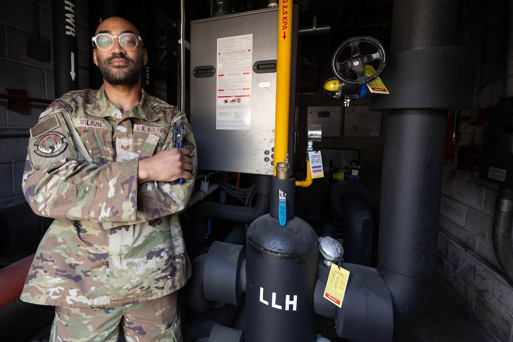 Airman poses with tools.