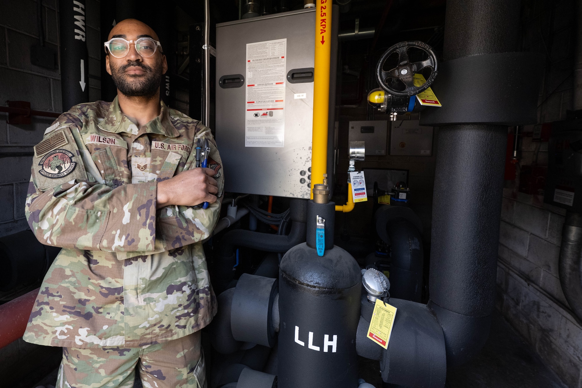 Airman poses with tools.