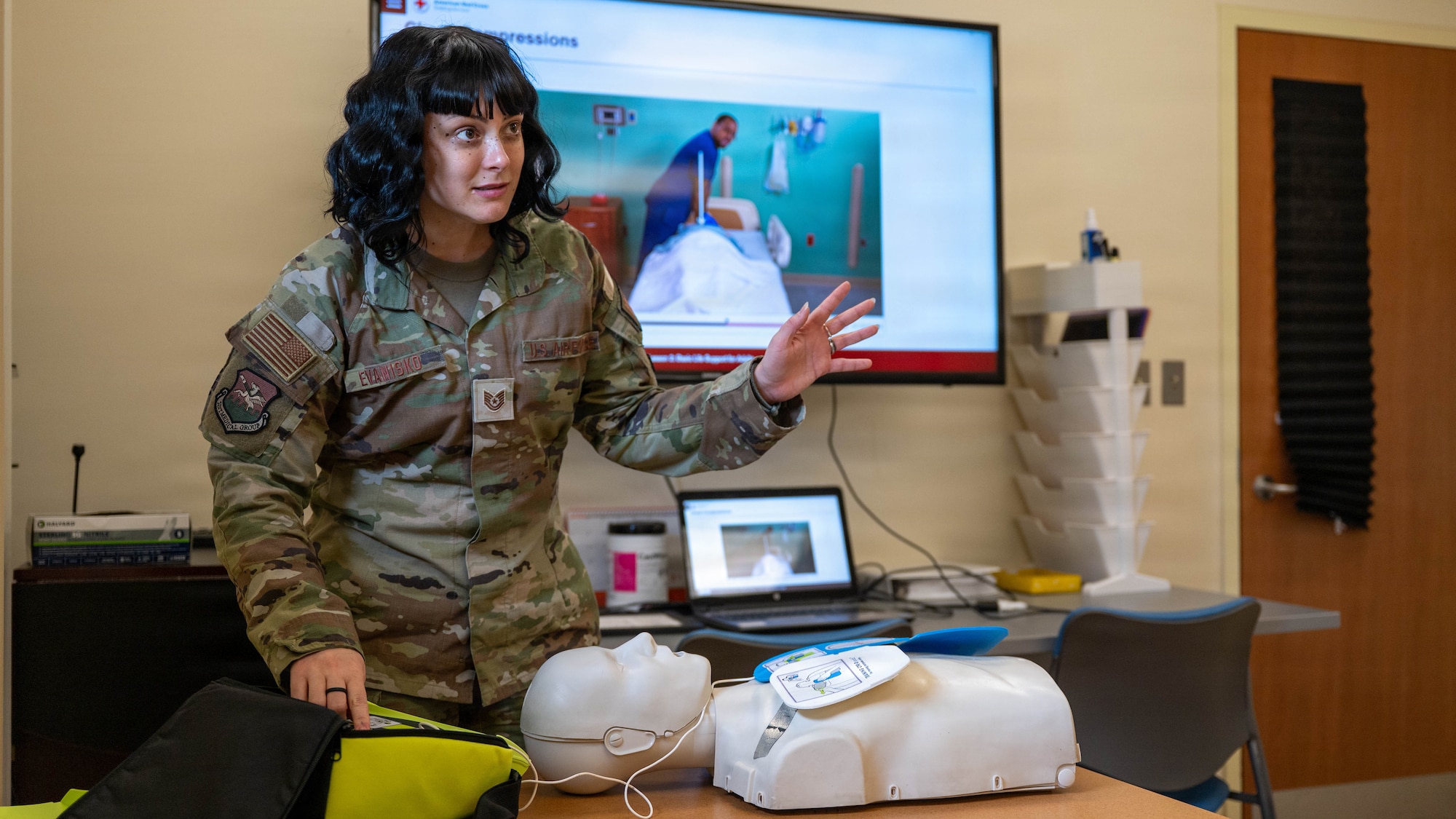 U.S. Air Force Tech. Sgt. Maegan Evanisko, 51st Medical Group education and training flight noncommissioned officer in charge, instructs Airmen during a basic life support course at Osan Air Base, Republic of Korea, April 29, 2026. Evanisko oversees critical medical training and certification programs, helping ensure Airmen are prepared to respond effectively in emergency situations. (U.S. Air Force photo by Airman 1st Class Megan Cusmano)